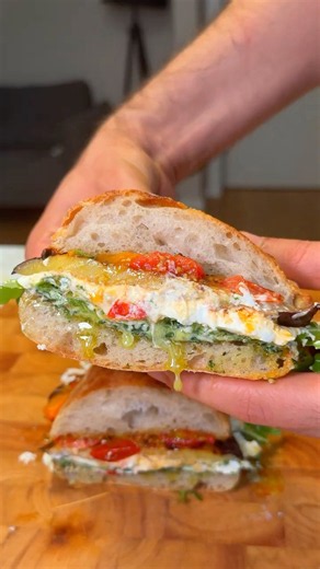 How to make grilled eggplant pesto sandwich with arugula and tomato