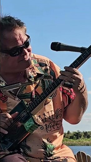 How to play blues slide riffs and incorporating harmonics on a 3 String Cigar Box Guitar