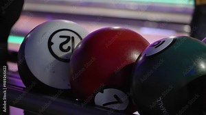 Kid catching s size bowling ball for children from ball return machine at bowling alley