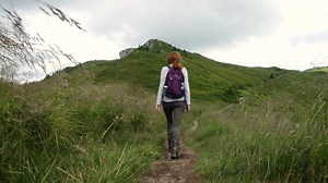 Woman hiking in a mountain path - Free Stock Video