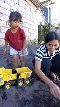 Dede Oming Playing in the Sand
