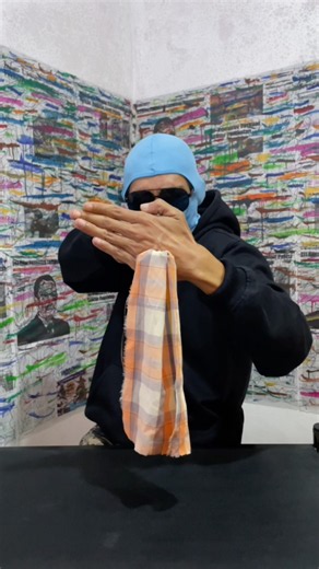 A trick to make a cloth pass through the palm of your hand.
