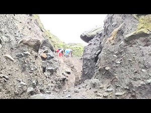 See how the miners lower the sand from the cliff, which below separates the rock and sand.