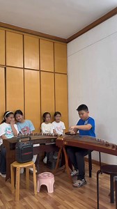 18K views · 1K reactions | This boy plays the Guzheng with amazing skill! His powerful performance catches the attention of his friends, who gather around to watch in awe! The guzheng, often referred to as the "Oriental Piano," is one of China's unique and significant traditional instruments. #instrument #music (cr: douyin wuwangle9) | T-Time HK | Facebook