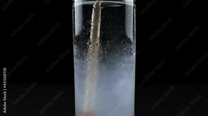 Dissolve the oil in the water with dish soap. Oil dissolving science concept