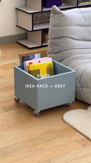 Charlène on Instagram: "My favorite Ikea hack 🥹 Eket + Rill • Eket - Cabinet Light Grey Blue / 35x25x35cm • Rill - Casters 4x I had already seen hacks with Eket several times, but never for storing books — I thought it would be perfect to hold big books. It also works for vinyl records. And how can I put it? I think this is my favorite hack 🤭 The blue color is perfect and it adds a little design touch next to the sofa 💙 @ikea @ikeafrance #interiorstyling #loftinterior #d