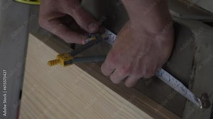 Close-up of a person drawing a geometric circle with a compass. Draw a circle on white paper using a compass. Stock Video