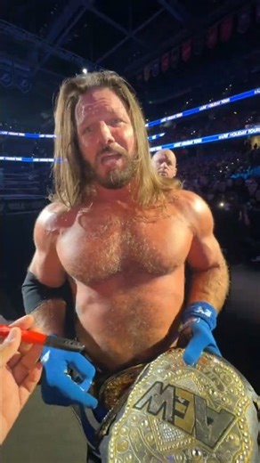 Fan Tries to Get AJ Styles to Sign an AEW Title… His Reaction Says It All