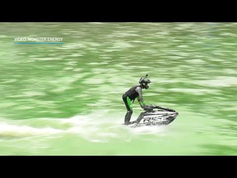Jet ski stunts wow crowds on a green Chicago River