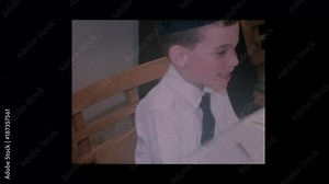 1964 4 year old Little jewish boy reads the four questions at Passover Seder