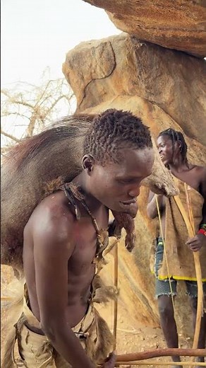 Bush survival: Hadzabe preparing kasongo meat over an open fire