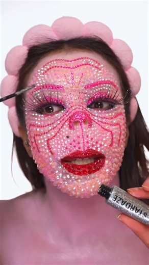 Atarah Mayhew on Instagram: "PINK GRINCH! 💖 Rhinestone Makeup Tutorial! 🎄 Powder- @sheglam_official Paints- @mehronmakeup Lashes- @eldorafalseeyelashes Spray+Mascara- @makeuprevolution Glue- @ardellbeauty Lenses- @pinkyparadisedotcom Accessories- @amazon"