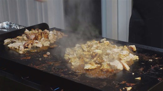 Recreating the hibachi restaurant experience at home with entertaining tricks and delicious food