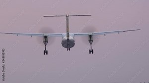 HD - Turboprop aircraft landing on runway. Close-up