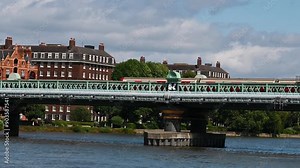 District Line from Wimbledon into Central over Putney Bridge, London, United Kingdom
