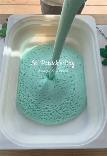 2 ingredient sensory play! 🫧☘️ What you need: 1 cup of water Squeeze of dish soap or bubble bath Food coloring (optional) Add everything to a blender and turn it on! You can also use a hand mixer. Include scoops, bowls, funnels, sponges, whisks, gold coins, toy figurines, measuring cups and a clean bowl of water for added fun! #sensoryplayideas #toddleractivities #stpatricksday #preschoolactivities #learningthroughplay