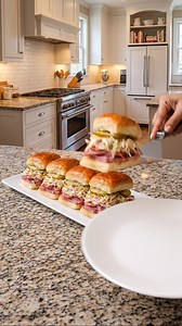 Chopped Italian Sliders ⏱️ Time Prep time: 20 minutes Cooking time: 10 minutes Total time: 30 minutes 🍽️ Serves 6–8 sliders 🧾 Ingredients Sliders 6–8 slider buns (Hawaiian rolls preferred) 120 g salami, chopped 120 g pepperoni, chopped 120 g ham, chopped 120 g provolone cheese or mozzarella (sliced or shredded) Dill pickle slices (optional, like in the photo) Chopped Italian Salad 1 cup shredded iceberg lettuce 2 tbsp red onion, finely diced 2 tbsp banana peppers or pepperoncini, chopped 2 tbs