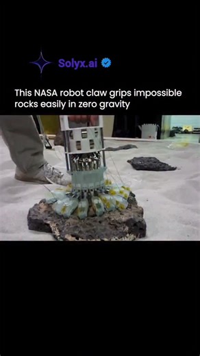 solyx- Ai innovation |Ai news |tech news on Instagram: "This image showcases a breakthrough in NASA robotics: a robotic claw designed to grip irregular, impossible-shaped rocks even in zero gravity. Traditional mechanical grippers fail in space because there is no weight, friction, or stable surface. NASA solved this using soft robotics, flexible actuators, and bio-inspired engineering, allowing the claw to conform to uneven surfaces and securely anchor itself. This technology is crucial for ast