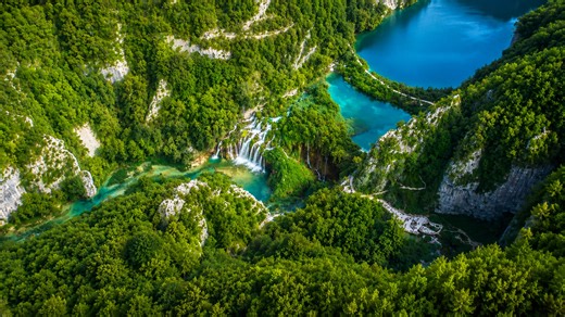 Turquoise lakes surrounded by steep green cliffs