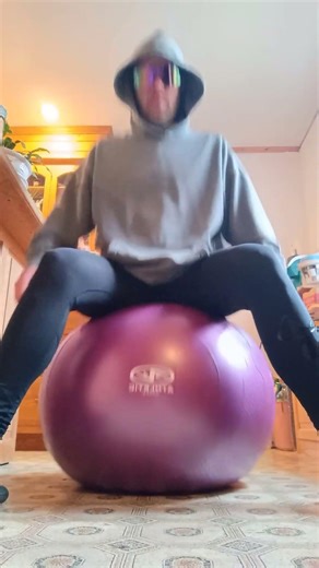 purple exercise ball bouncing