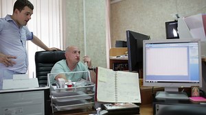 Two men working in a small office - Free Stock Video