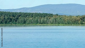 Place of meteorite fall. Chebarkul lake. Mountain forest. Panorama. Gray sky. Small fog. Haze.
