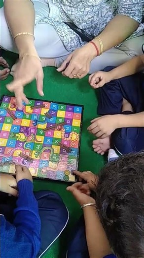 Learning maths with Snake and Ladders game by Kids at Prema's School Jodhpur