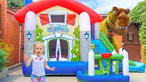 Nastya and the dinosaur on an inflatable trampoline | Vlad FamilyShow