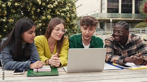 Group of students working and learning together using laptop to study for exams