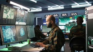 Army computer scientist employing AI technology in military planning and decision making processes. Expert uses artificial intelligence to enhance armed forces operational capabilities, camera B