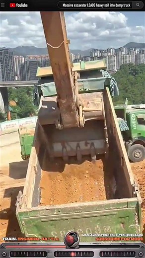 Operation excavator LOADS heavy soil into dump truck
