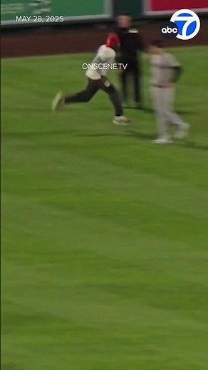 Fan runs onto the field during Angels vs. Yankees game