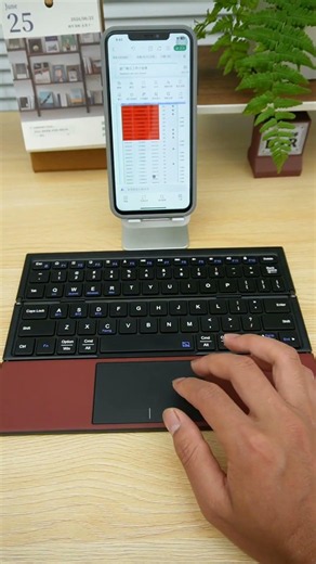 This folding keyboard amazing! It has a built-in touchpad, so you don't need to carry separate mouse