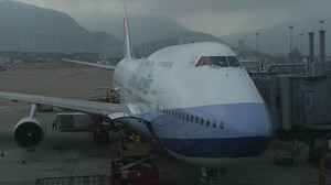 Loading freight onto a large plane - Free Stock Video