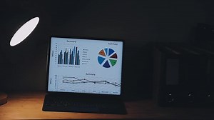 Download A laptop with a graph on the screen for free