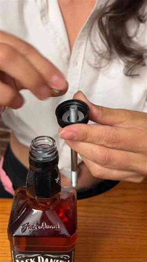 How a bartender creates a custom bottle with hydro dipping