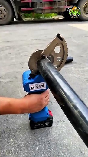 Precision Pipe Cutting | Expert Use of Electric Pipe Cutter in Industrial Setting