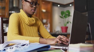 African american woman using laptop while working from home Free Stock Video Footage