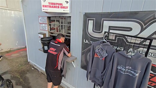 Andrew Grady, starting 22nd in the South Carolina 400 picks up some retro Myrtle Beach Speedway merchandise to support the promotional group at Florence. | Short Track SCENE