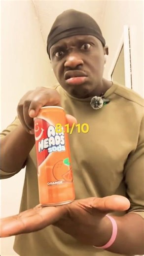 Muscle man tries air head soda.