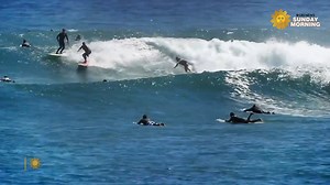Originally a sport of Hawaiian royalty, surfing was taken to the next level once surfboard designers started making boards shorter and lighter. https://cbsn.ws/3cnFjxa | CBS Sunday Morning