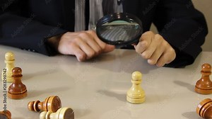 the figure is viewed through a magnifying glass. Choosing the best candidate. the concept management human resources HR and recruitment