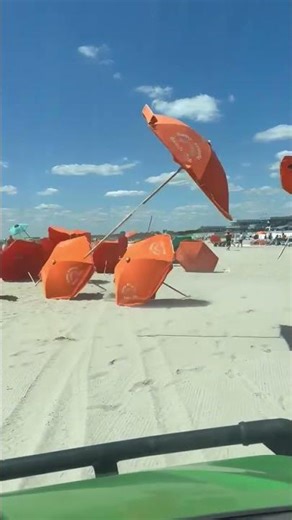 Sudden Wind Storm Sends Beach Umbrellas Flying