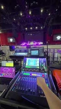 Controlling an arena stage lighting rig from an audio mixing console.