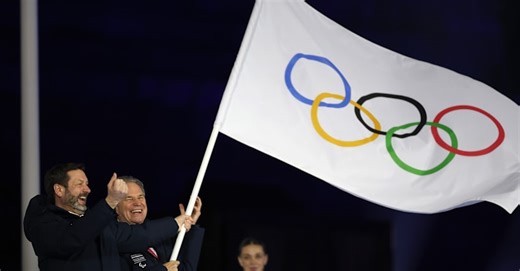 Olympic flag handover indicates transition to French Alps