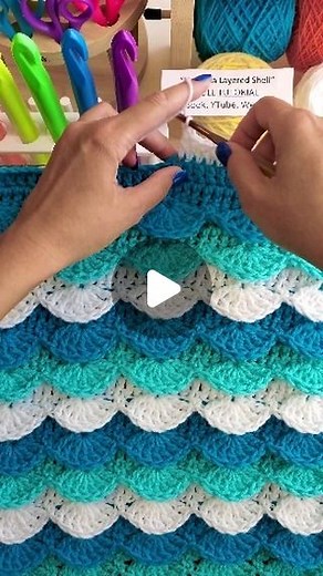 Naztazia on Instagram: "You can crochet this layered shell stitch to look like ocean waves using shades of blue, green, and white yarn. The pattern consists of single, double and treble crochet stitches. #crochet #knittinginspiration #ocean #artistoninstagram #wool #yarn #pattern #waves #embroidery #textileart #makingmemories #naztazia #reels"
