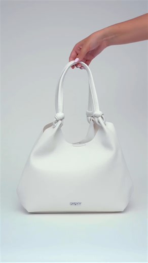 Sounds like the perfect Summer pairing. The DKNY Paula Commuter Tote x Loverboy. @drinkloverboy | DKNY