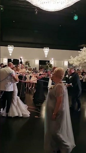 Italian Wedding Tradition: A Beautiful First Dance in Glamorous Ballroom under Grand Chandelier