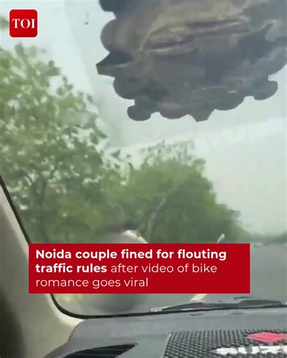 A video of a man and woman performing a dangerous stunt on a motorcycle along the #Noida-#GreaterNoida Expressway surfaced on social media, prompting the local #traffic police to issue a fine of Rs 55,000 for flouting traffic norms. Details here 🔗 http://toi.in/hgqy1b87 #UttarPradesh | The Times of India