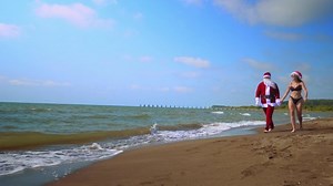 clip-1096848063-christmas-holidays-santa-claus-sexy-woman-girl